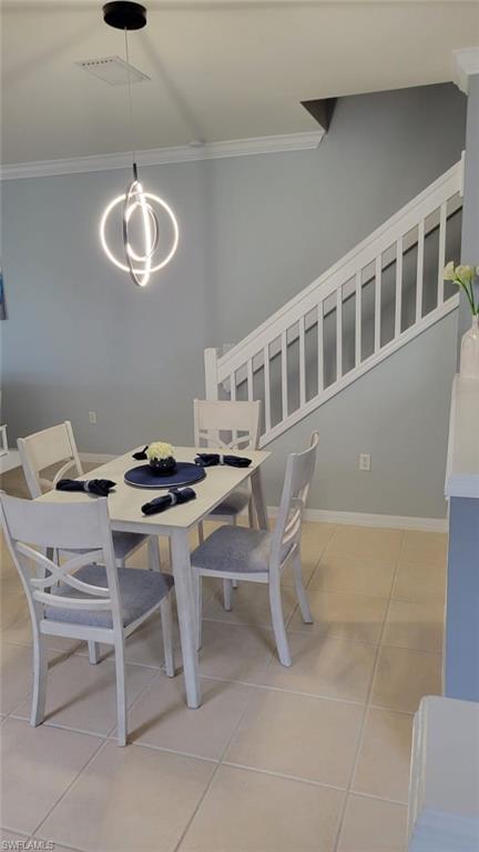 993 Hampton Circle, Unit 122 Naples, FL 34105 - Photo 7 of 26 a dining room with furniture and a window