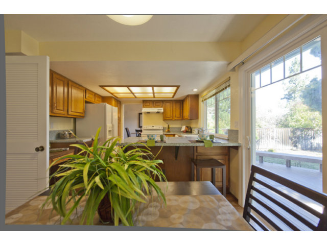 6502 McAbee Road San Jose, CA 95120 - Photo 12 of 25 a kitchen with a table and chairs in it