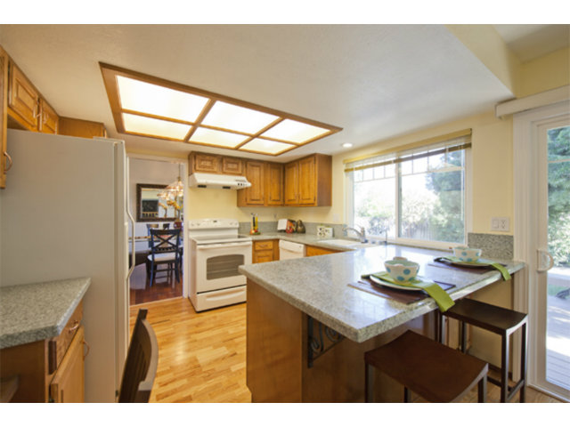 6502 McAbee Road San Jose, CA 95120 - Photo 16 of 25 a kitchen with a table chairs and window