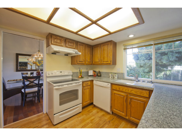 6502 McAbee Road San Jose, CA 95120 - Photo 17 of 25 a kitchen with a stove a sink and a refrigerator