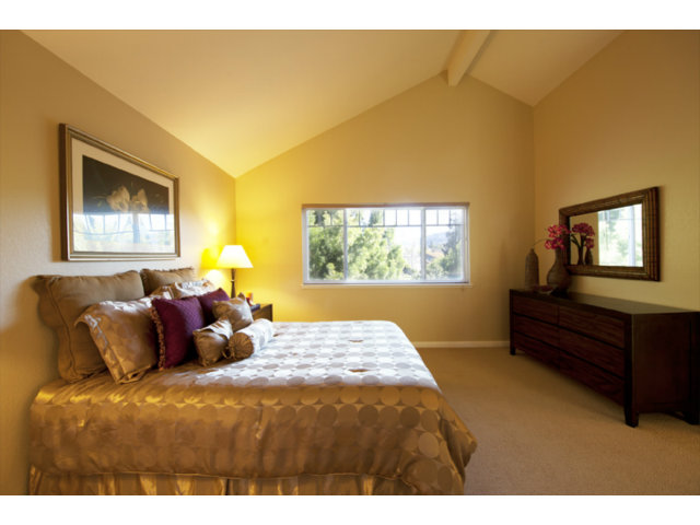 6502 McAbee Road San Jose, CA 95120 - Photo 23 of 25 a bedroom with a bed and a window