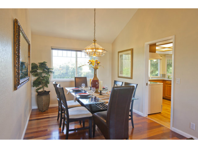 6502 McAbee Road San Jose, CA 95120 - Photo 4 of 25 a dining room with furniture a chandelier and wooden floor