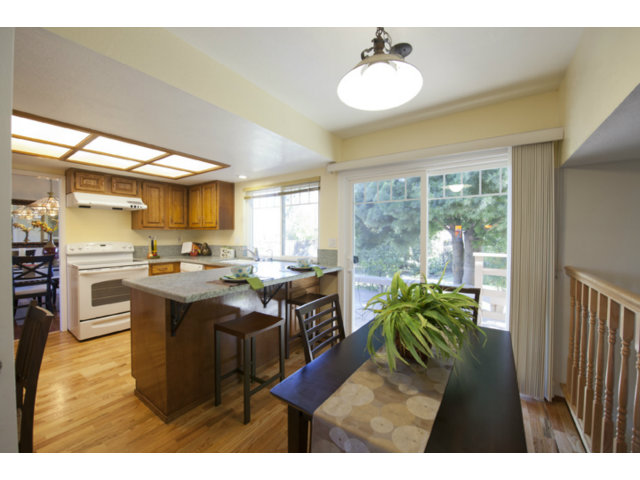 6502 McAbee Road San Jose, CA 95120 - Photo 6 of 25 a kitchen with kitchen island granite countertop a sink a counter top space and stainless steel appliances