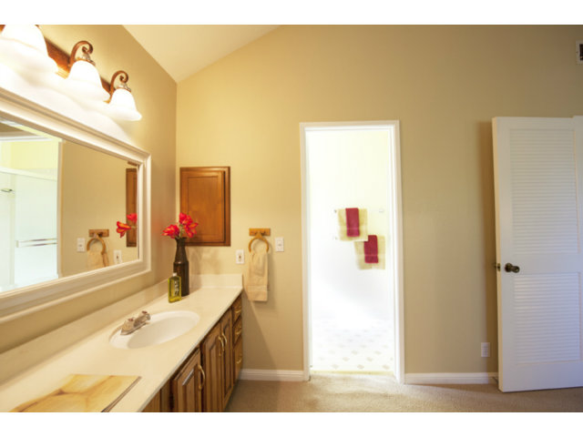 6502 McAbee Road San Jose, CA 95120 - Photo 8 of 25 a bathroom with a granite countertop sink and a mirror
