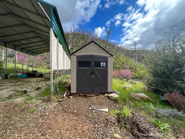 15923 Log Cabin Road French Gulch, CA 96033 - Photo 5 of 24 a front view of a house with garden