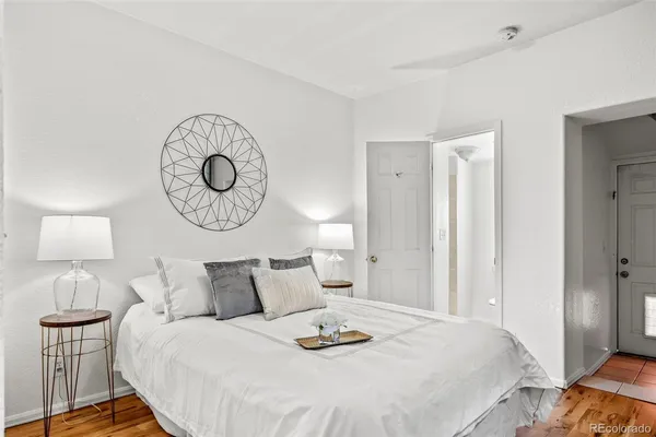 a bedroom with bed and a lamp