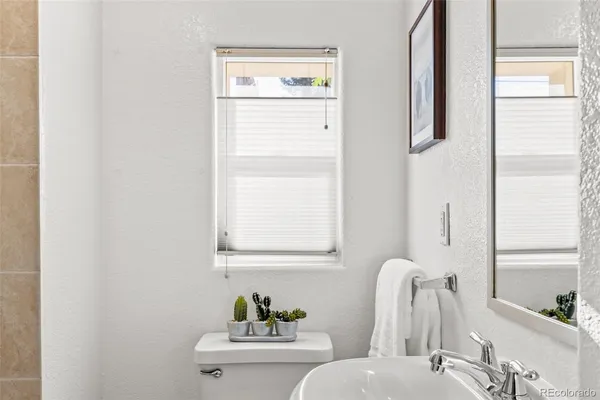 a bathroom with a toilet and a sink