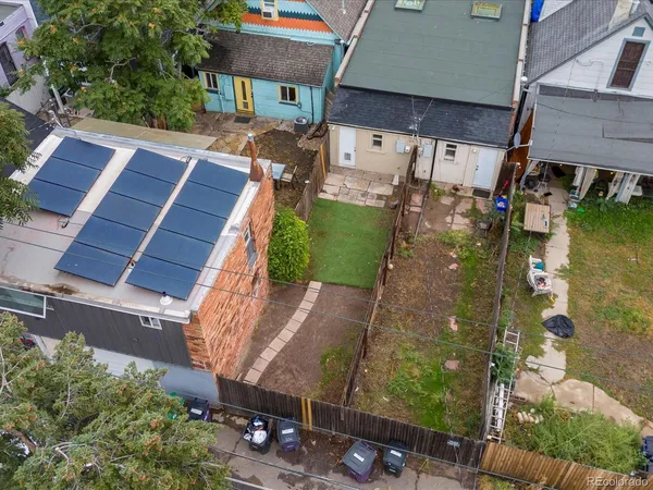 an aerial view of a house with a yard