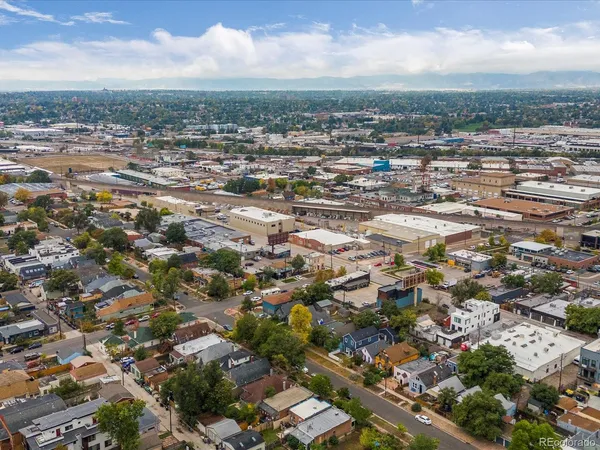 an aerial view of residential houses with city view
