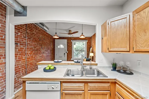 a kitchen with a sink and a window