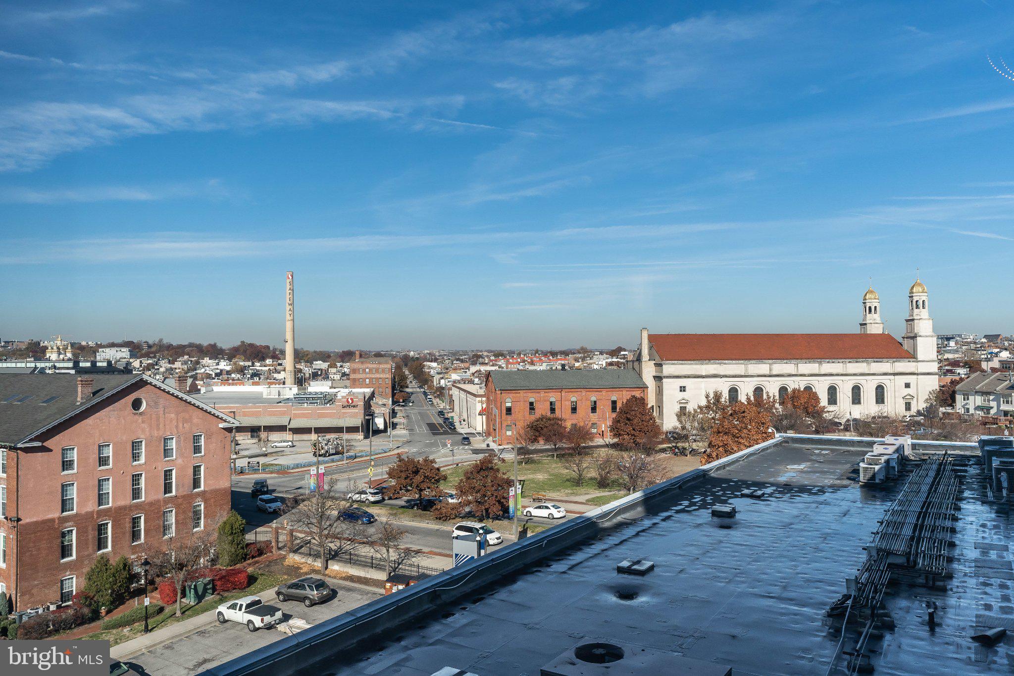 2702 Lighthouse Point East, Unit 532 Baltimore, MD 21224 - Photo 35 of 41 Urban skyline under a clear blue sky.