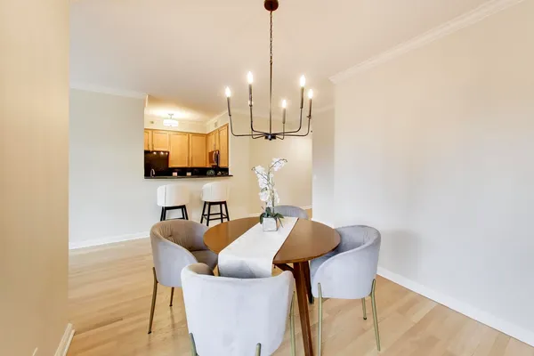 a view of a dining room with furniture and wooden floor