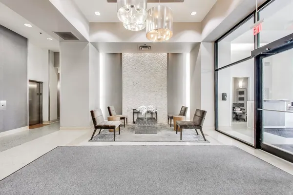 a view of a livingroom with furniture and chandelier