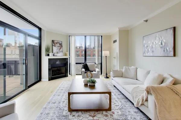 a living room with furniture and a large window