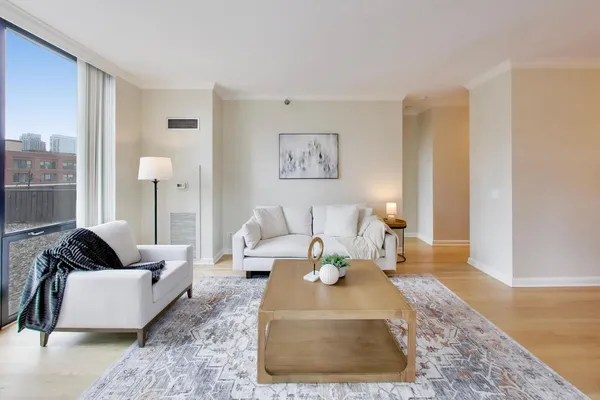 a living room with furniture and a rug