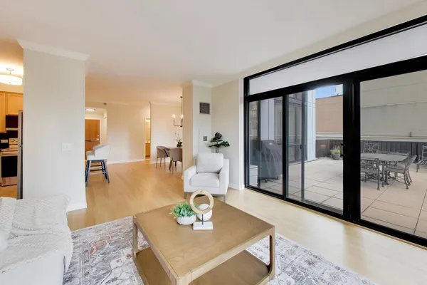 a living room with furniture and large window