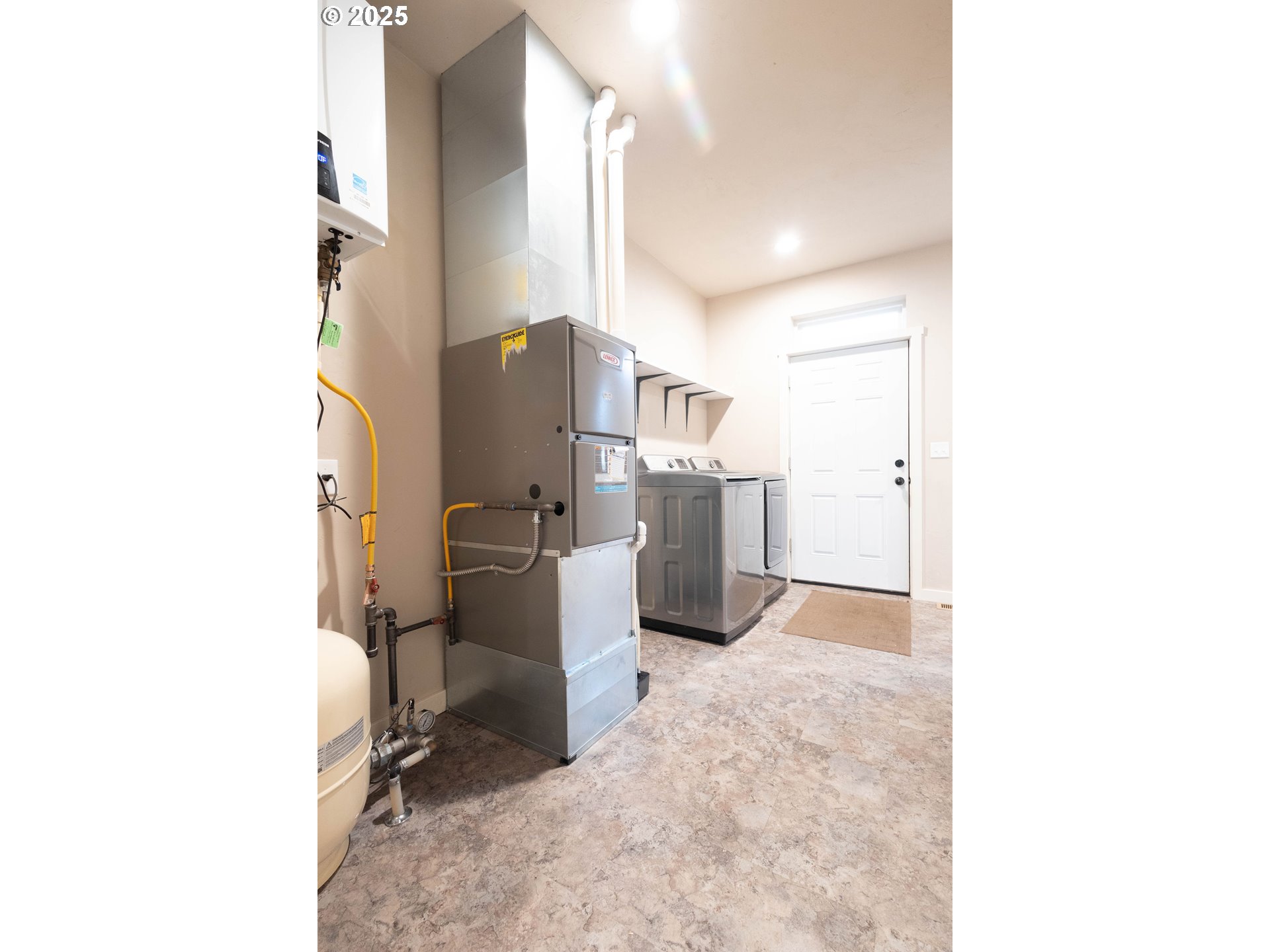 69717 Antles Road Cove, OR 97824 - Photo 14 of 38 a view of a kitchen with refrigerator and workspace