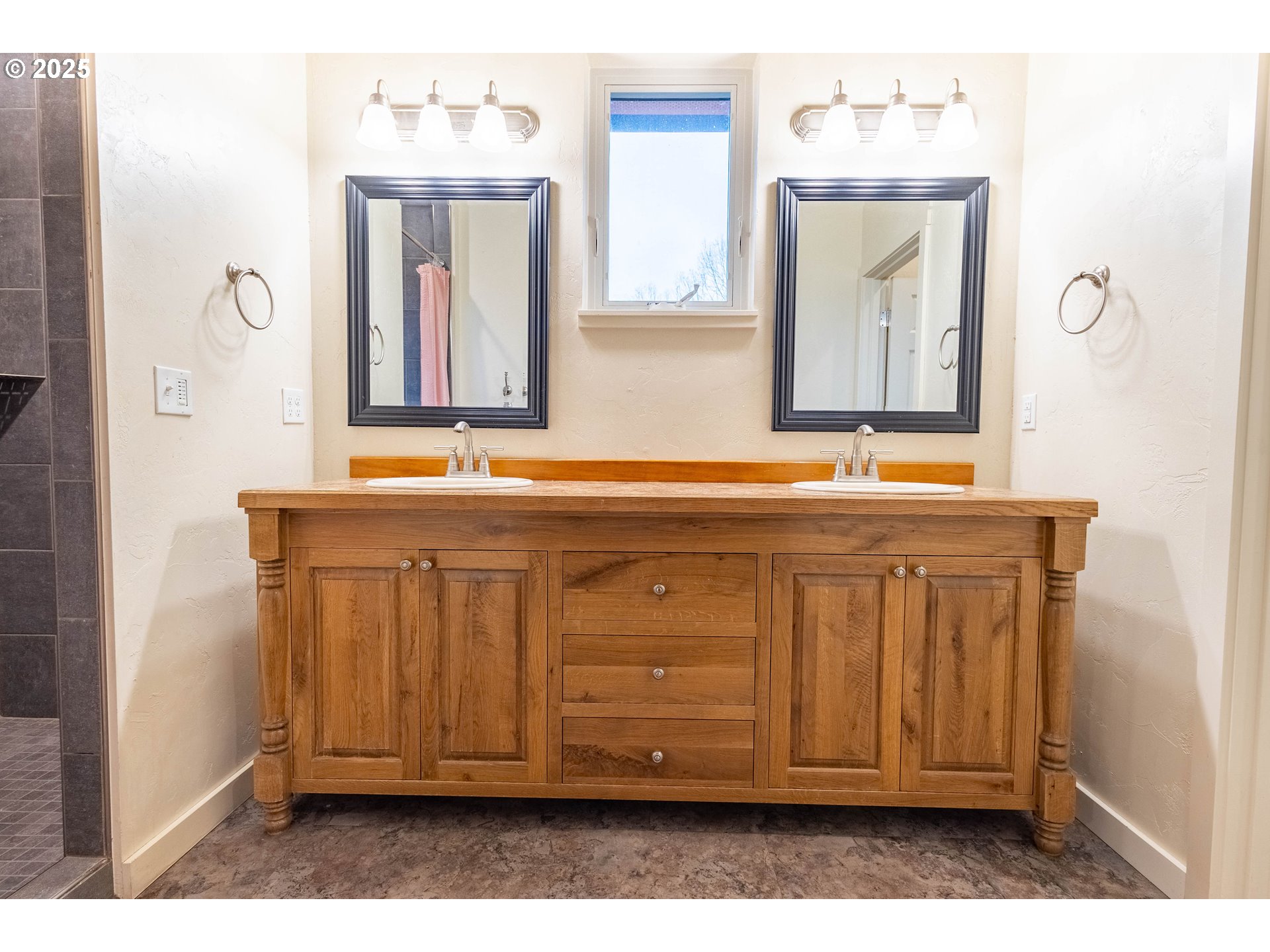 69717 Antles Road Cove, OR 97824 - Photo 19 of 38 a bathroom with a sink vanity and mirror