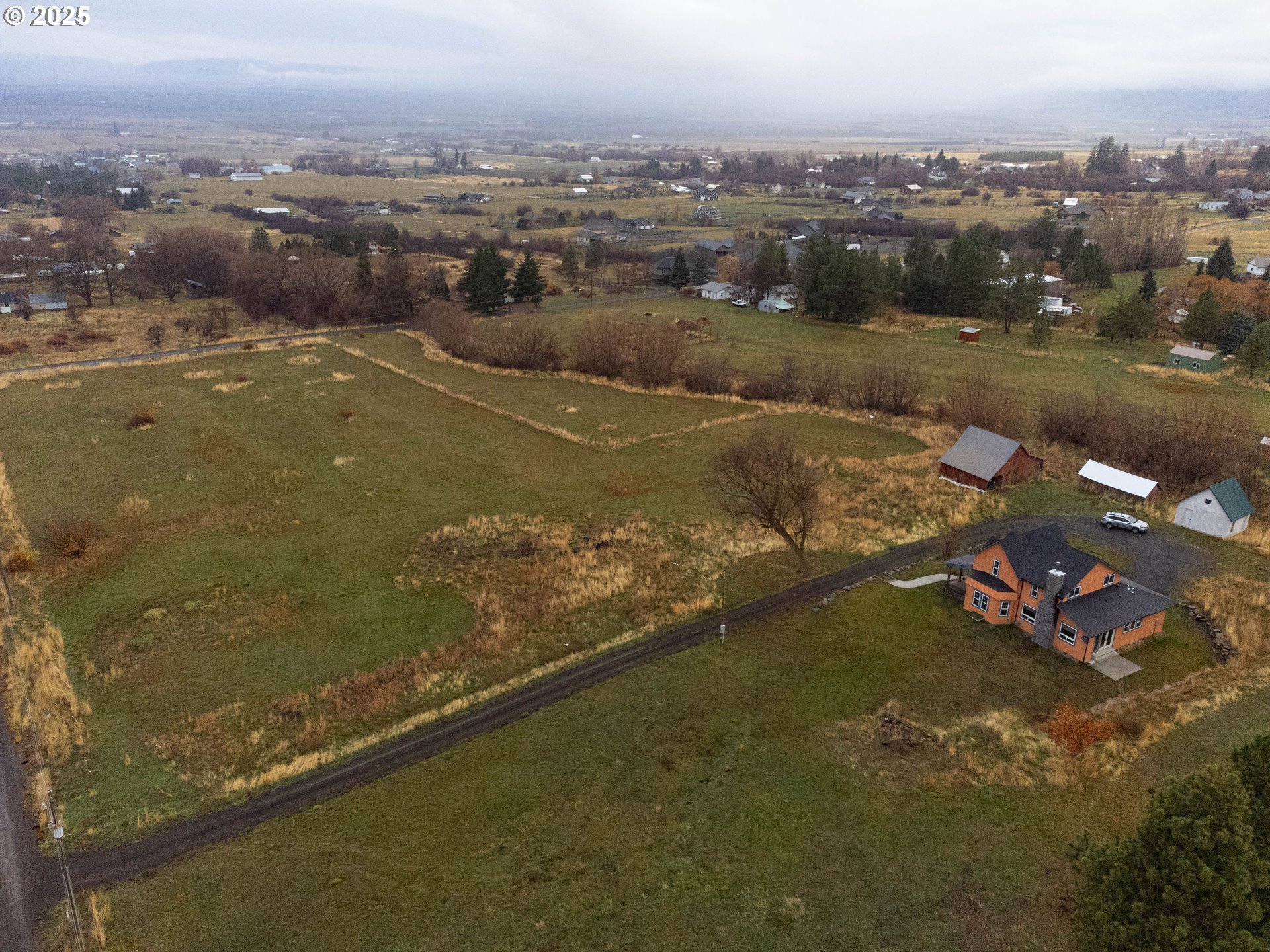 69717 Antles Road Cove, OR 97824 - Photo 37 of 38 an aerial view of residential houses with outdoor space