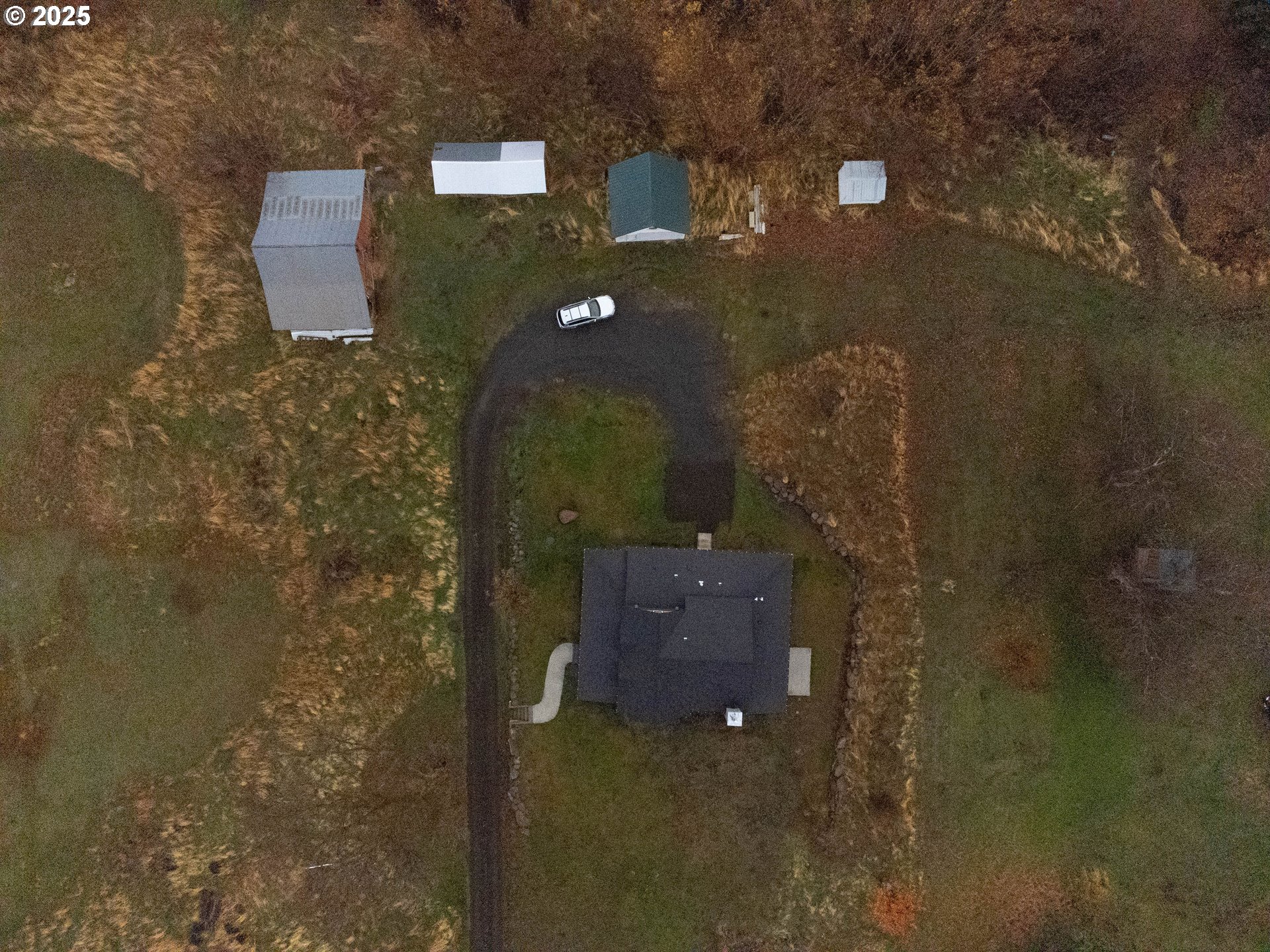 69717 Antles Road Cove, OR 97824 - Photo 38 of 38 an aerial view of a house with a yard