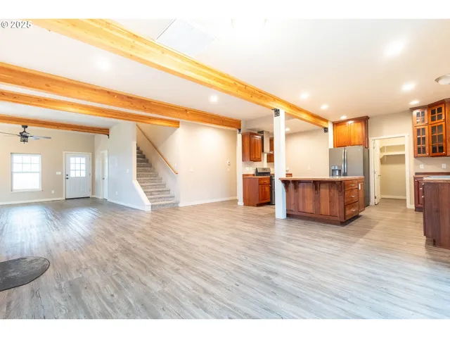 a view of a room with wooden floor