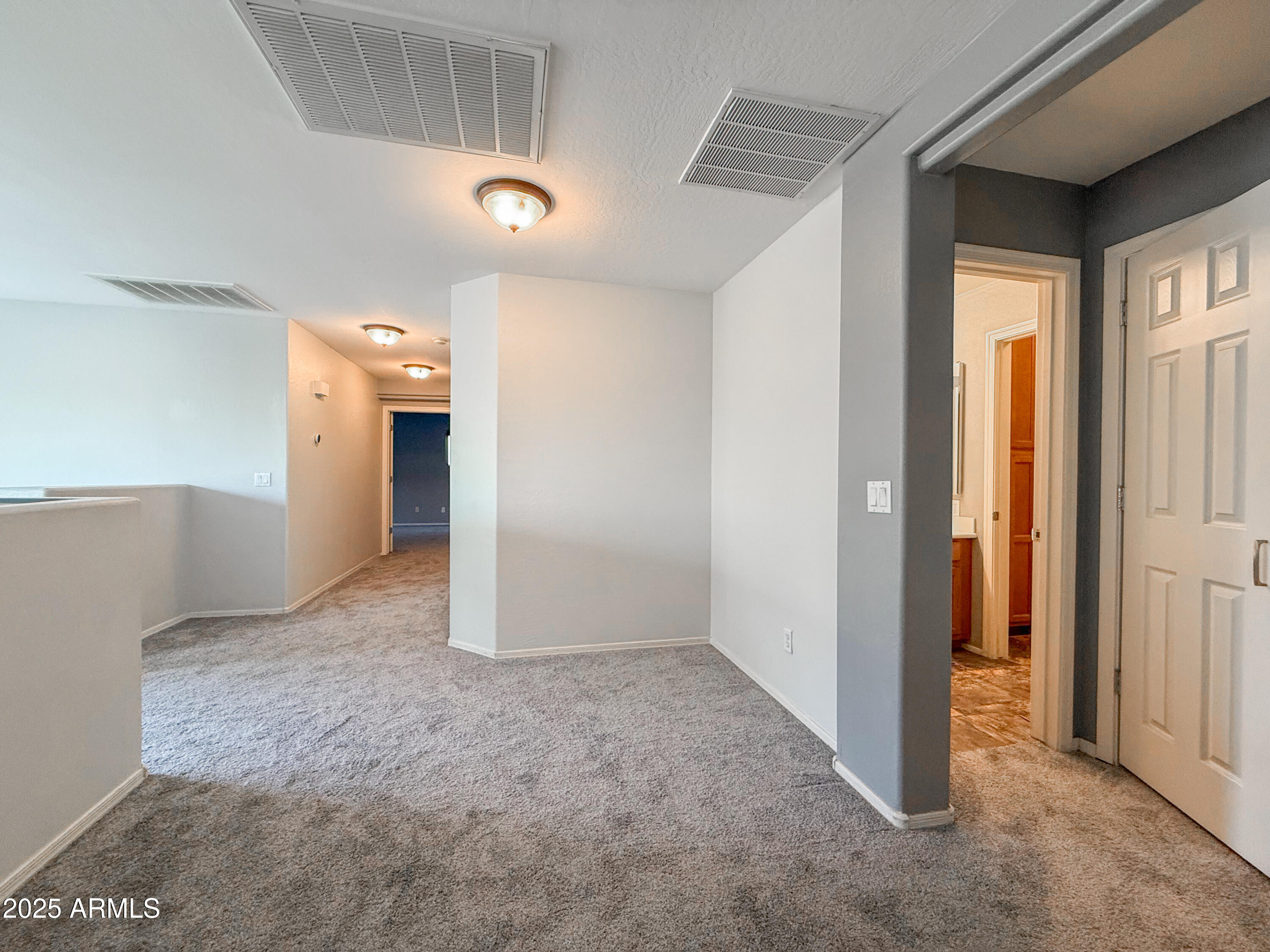 19716 East Thornton Road Queen Creek, AZ 85142 - Photo 28 of 62 an empty room with windows and entrance to other room