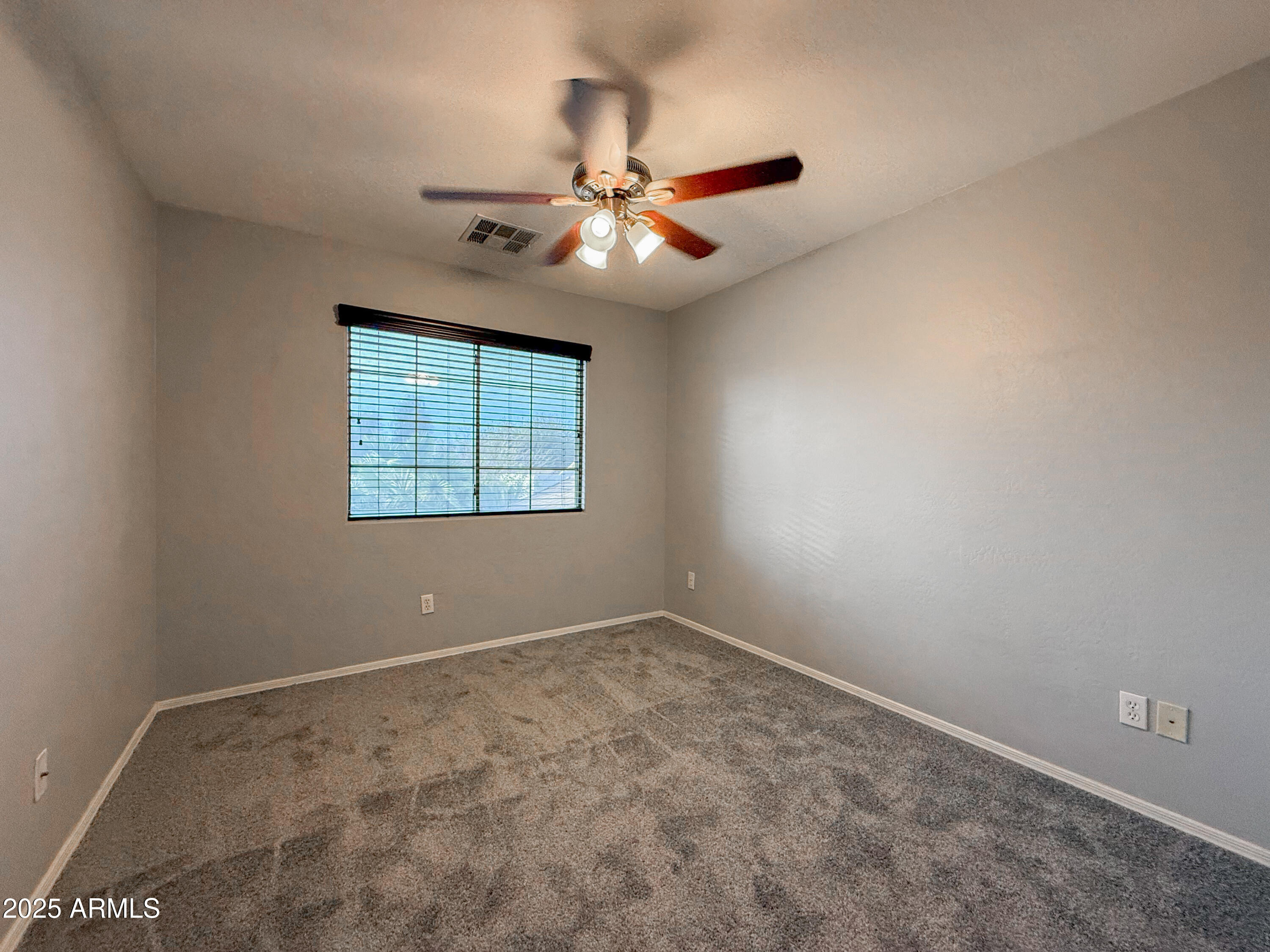 19716 East Thornton Road Queen Creek, AZ 85142 - Photo 29 of 62 an empty room with windows and fan