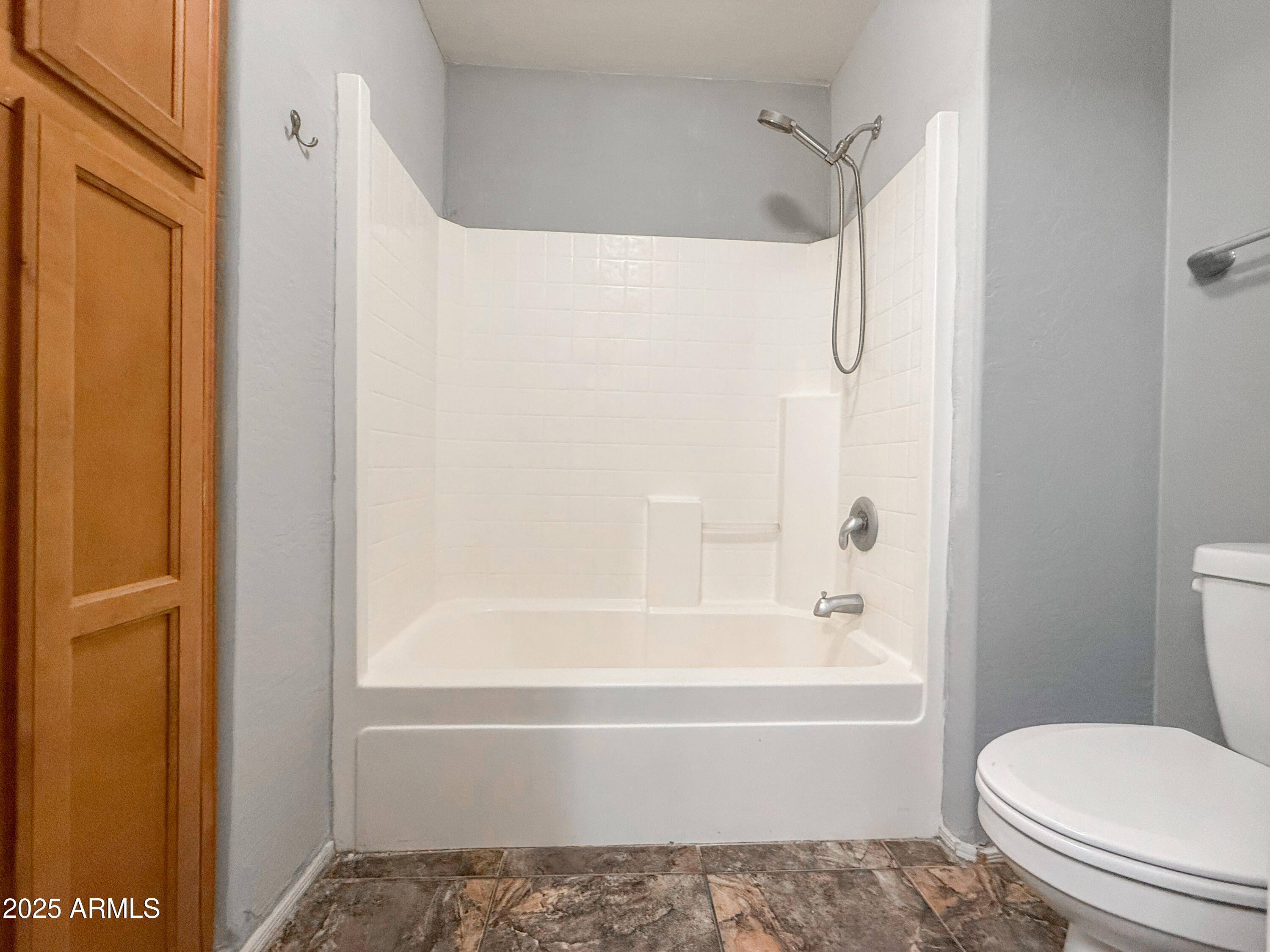 19716 East Thornton Road Queen Creek, AZ 85142 - Photo 46 of 62 a bathroom with a toilet and a bathtub