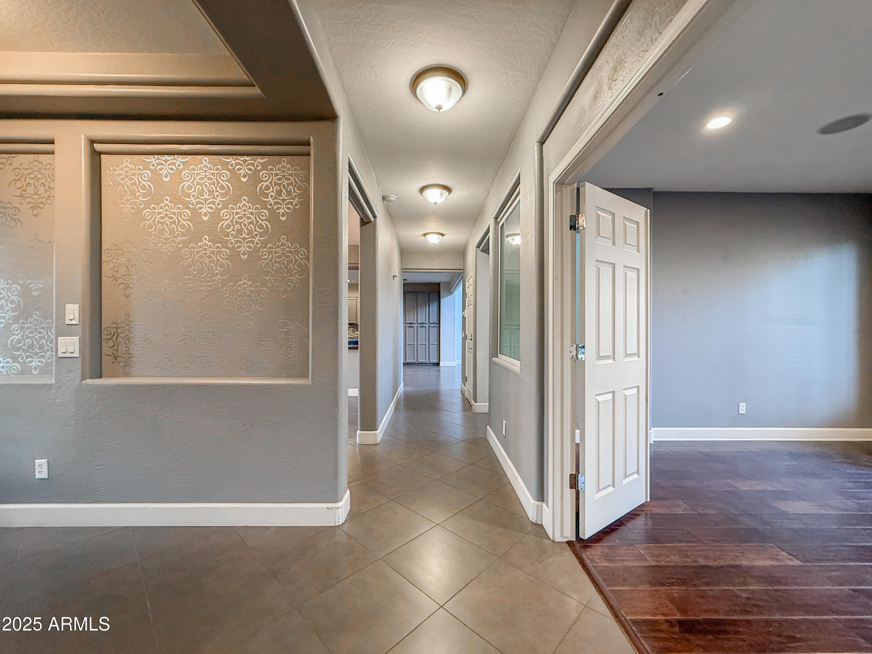 19716 East Thornton Road Queen Creek, AZ 85142 - Photo 6 of 62 a view of a hallway with wooden floor and glass door