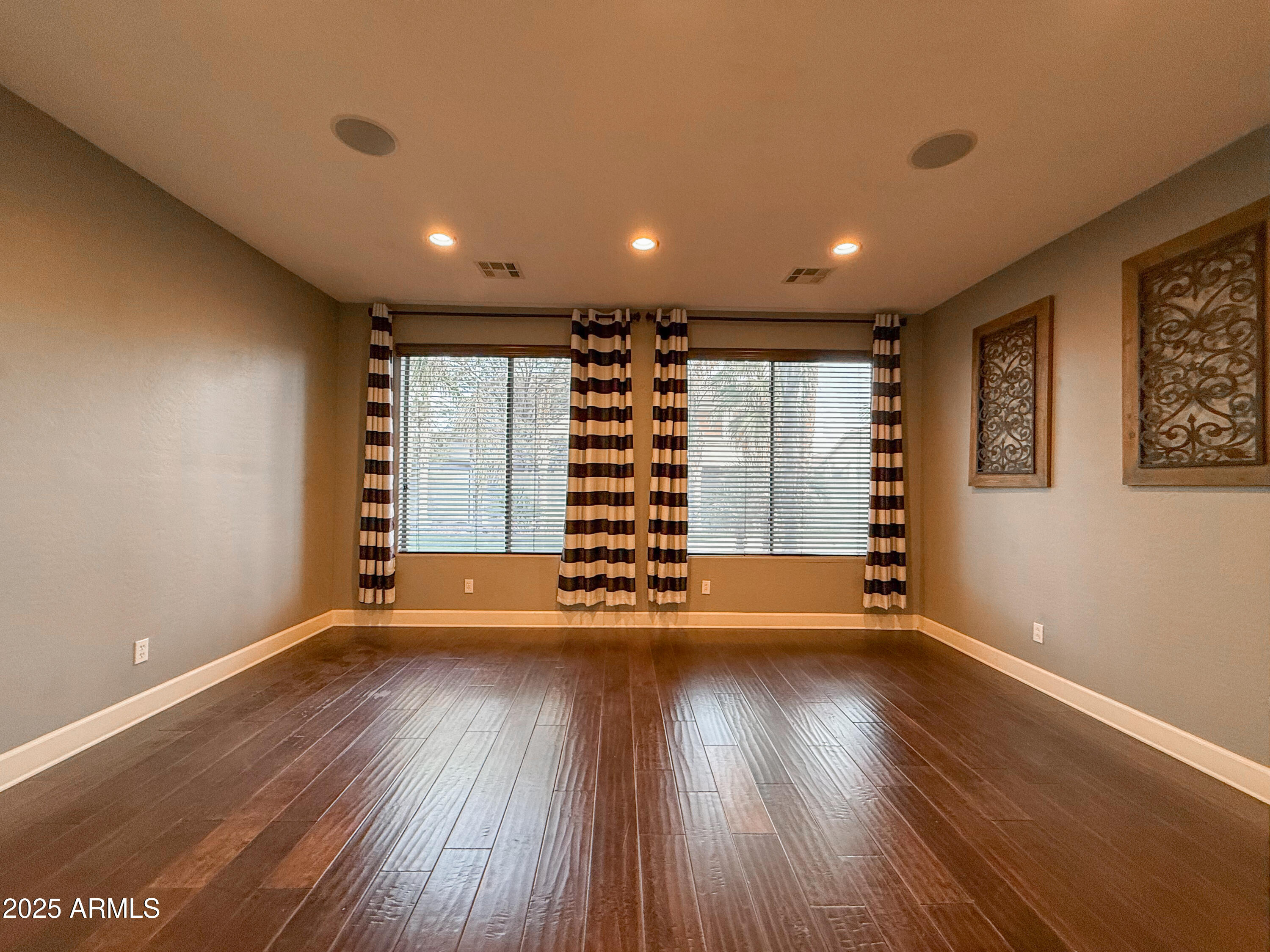 19716 East Thornton Road Queen Creek, AZ 85142 - Photo 8 of 62 a view of room with wooden floors and stairs