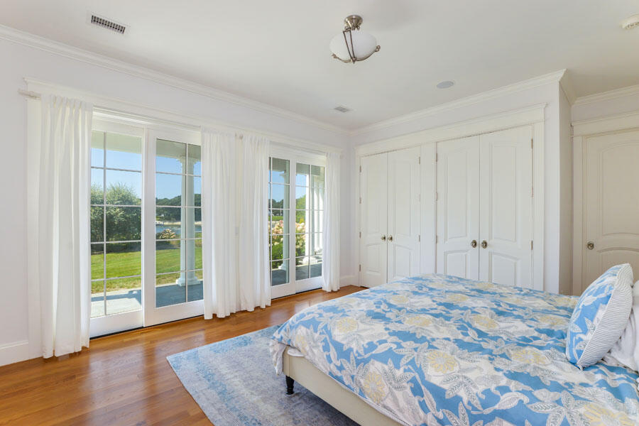 501 Eel River Road Osterville, MA 02655 - Photo 23 of 50 a bedroom with a bed and a window