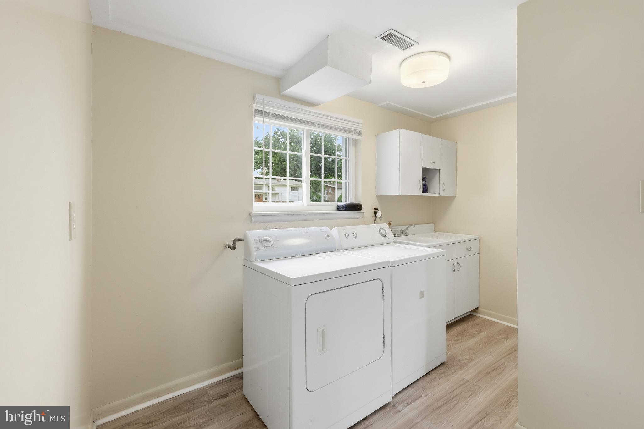 7434 Prince George Road Baltimore, MD 21208 - Photo 21 of 30 Dedicated laundry area with storage! Both Replaced