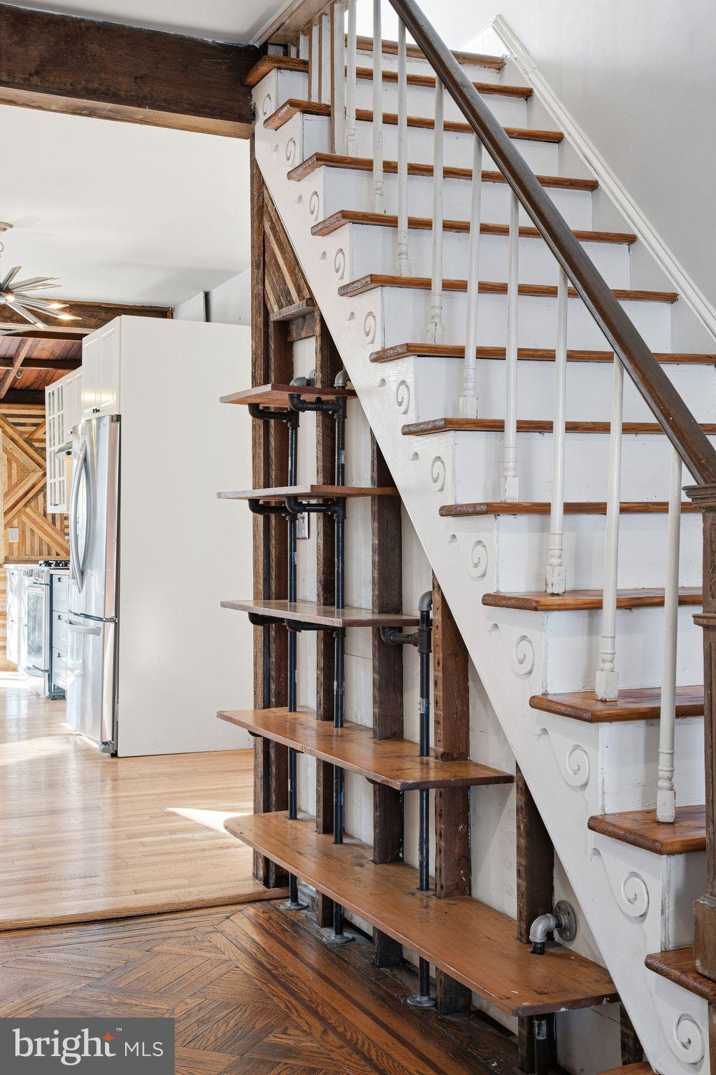 2142 East Huntingdon Street Philadelphia, PA 19125 - Photo 14 of 38 a view of entryway with wooden floor and stairs