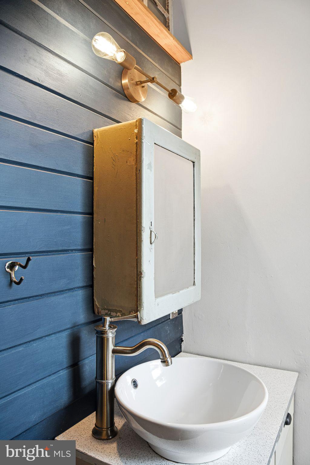 2142 East Huntingdon Street Philadelphia, PA 19125 - Photo 18 of 38 a bathroom with a sink and a mirror