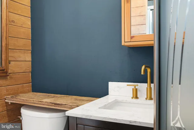 a bathroom with a sink and vanity