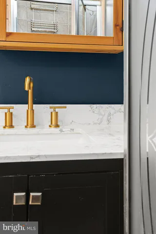 a bathroom with a sink and a window