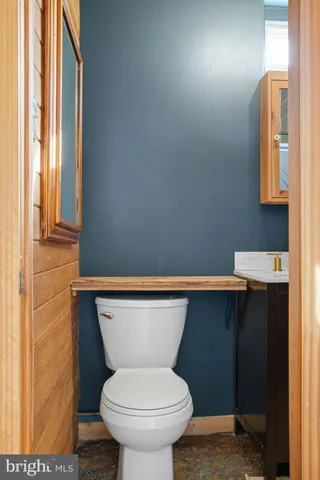 a bathroom with a toilet and a sink