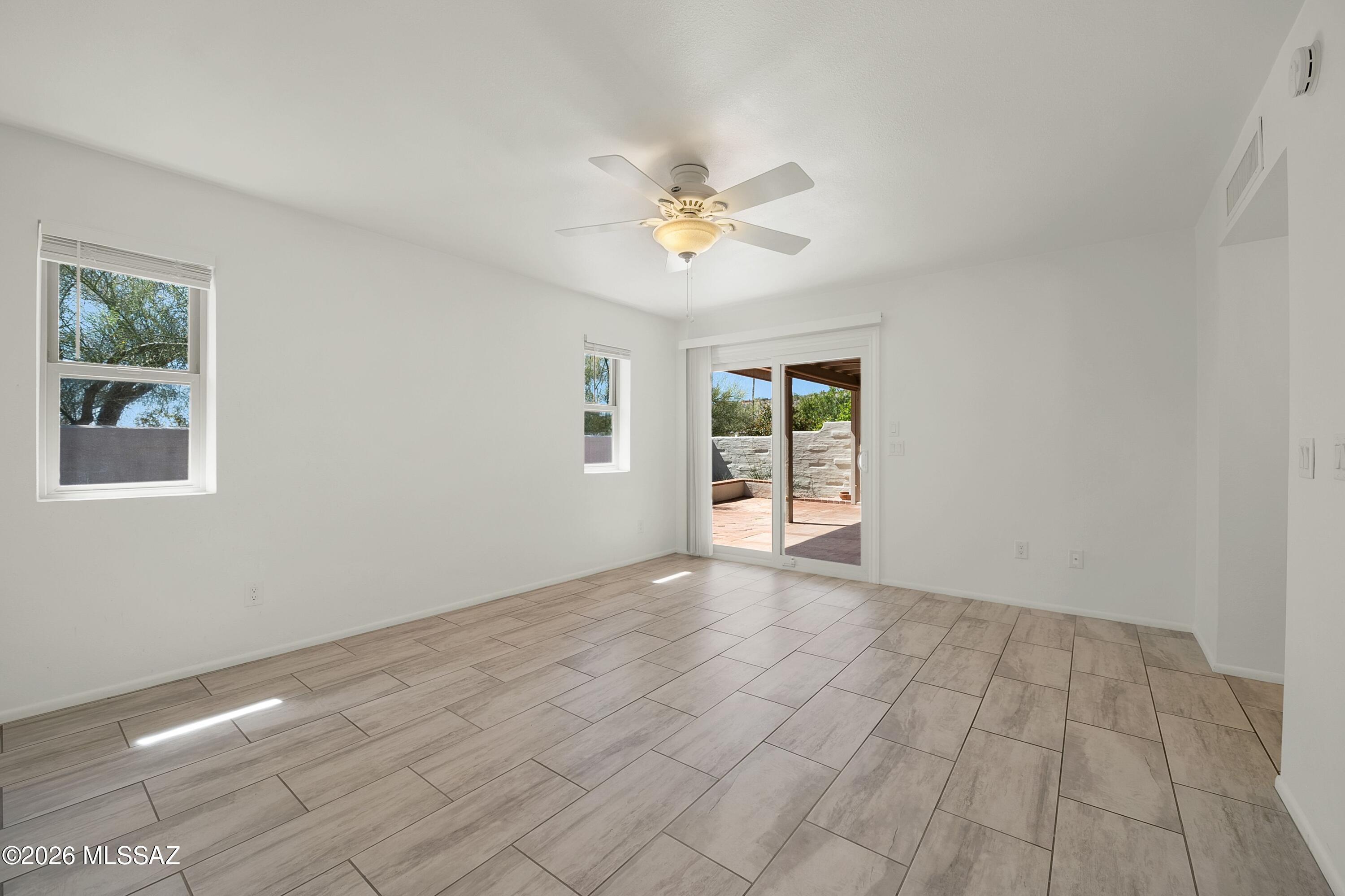 7408 East Wandering Road Tucson, AZ 85750 - Photo 15 of 25 a view of an empty room with a window