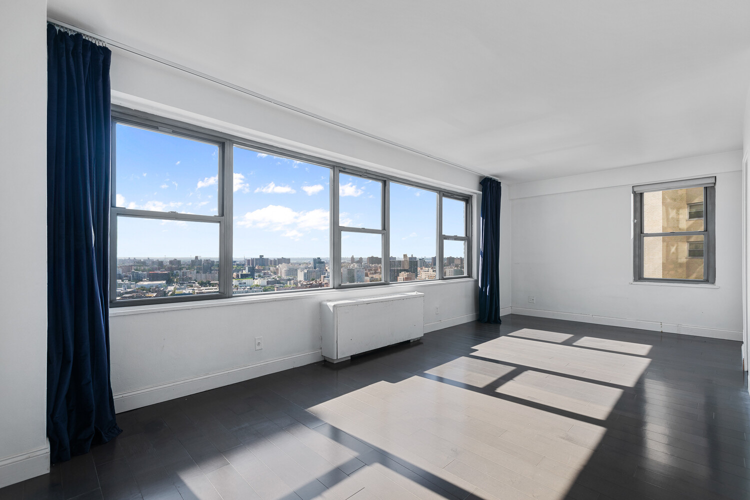 1020 Grand Concourse, Unit 20B Bronx, NY 10451 - Photo 5 of 10 a large white room with a large window