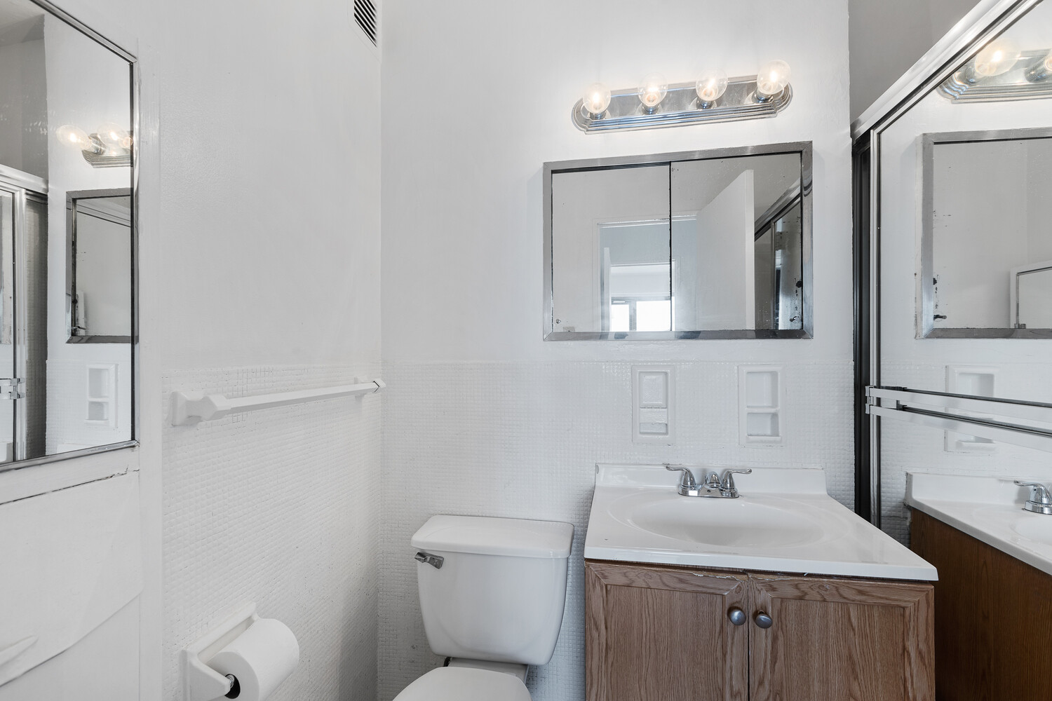 1020 Grand Concourse, Unit 20B Bronx, NY 10451 - Photo 8 of 10 a bathroom with a toilet sink and mirror