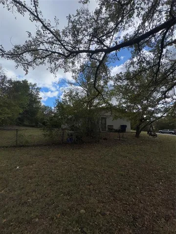 a view of patio and yard