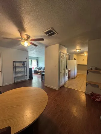 a view of a livingroom with furniture and a kitchen