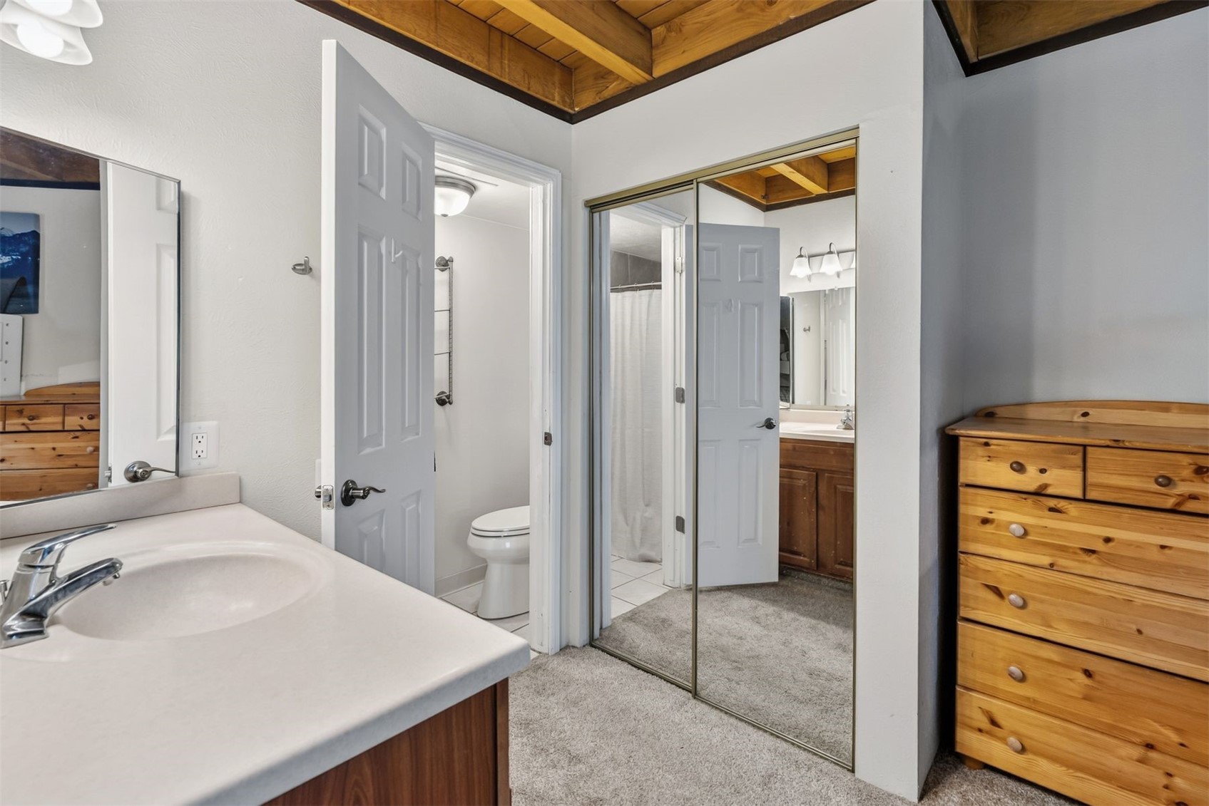 8100 Ryan Gulch Road, Unit 106 Wildernest, CO 80498 - Photo 15 of 43 a bathroom with a sink a toilet and shower