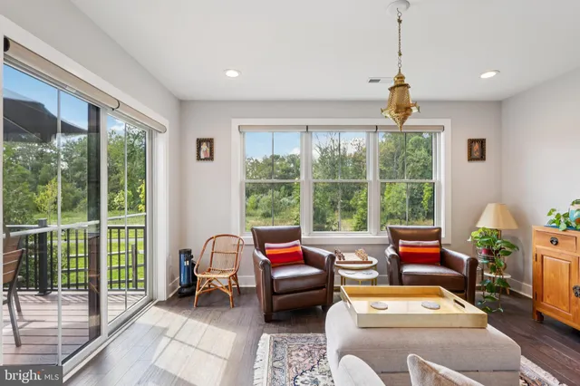 a reading room with furniture and a window