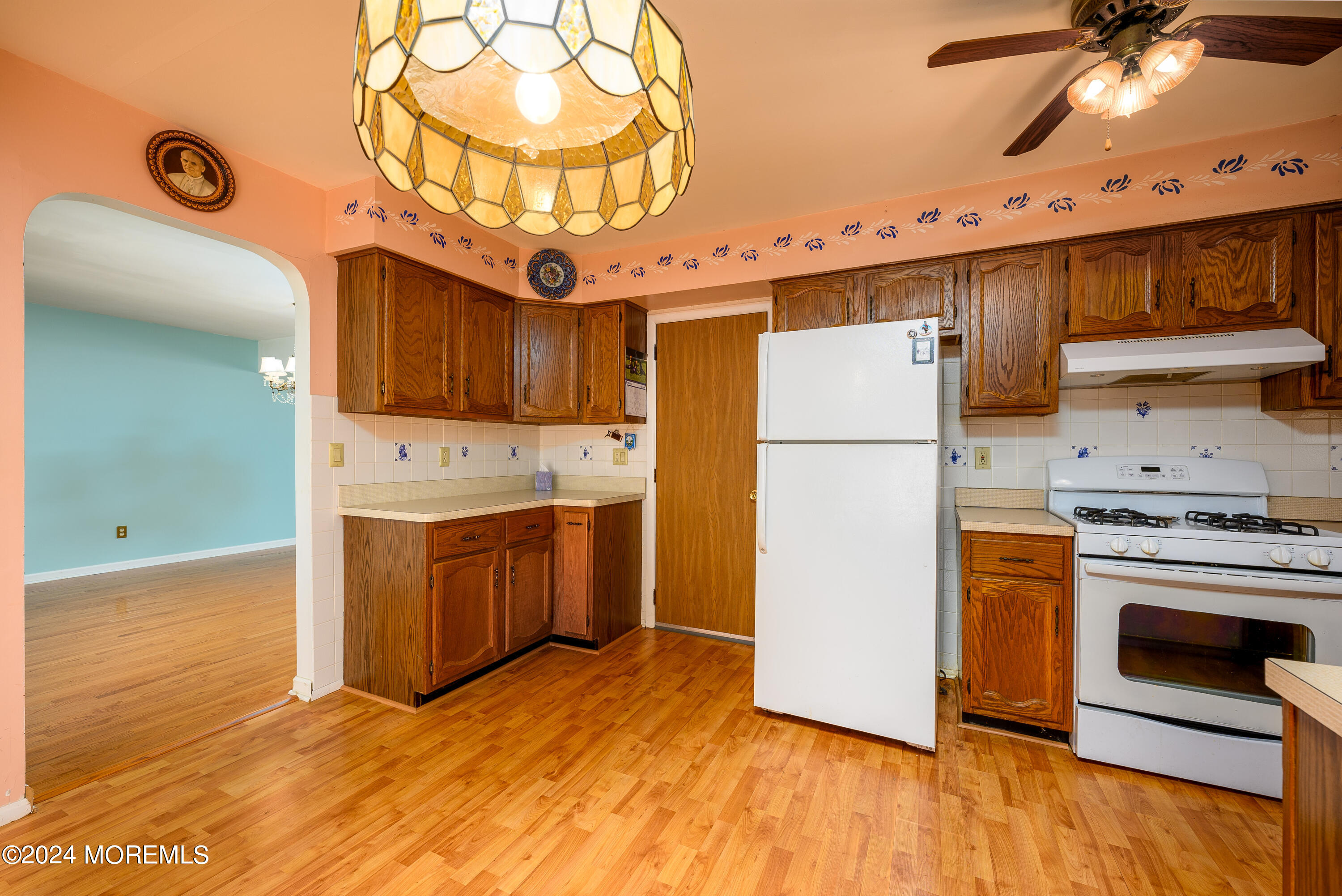 56 Auburn Road Toms River, NJ 08757 - Photo 11 of 28 a kitchen with stainless steel appliances granite countertop a refrigerator a stove and a wooden floors