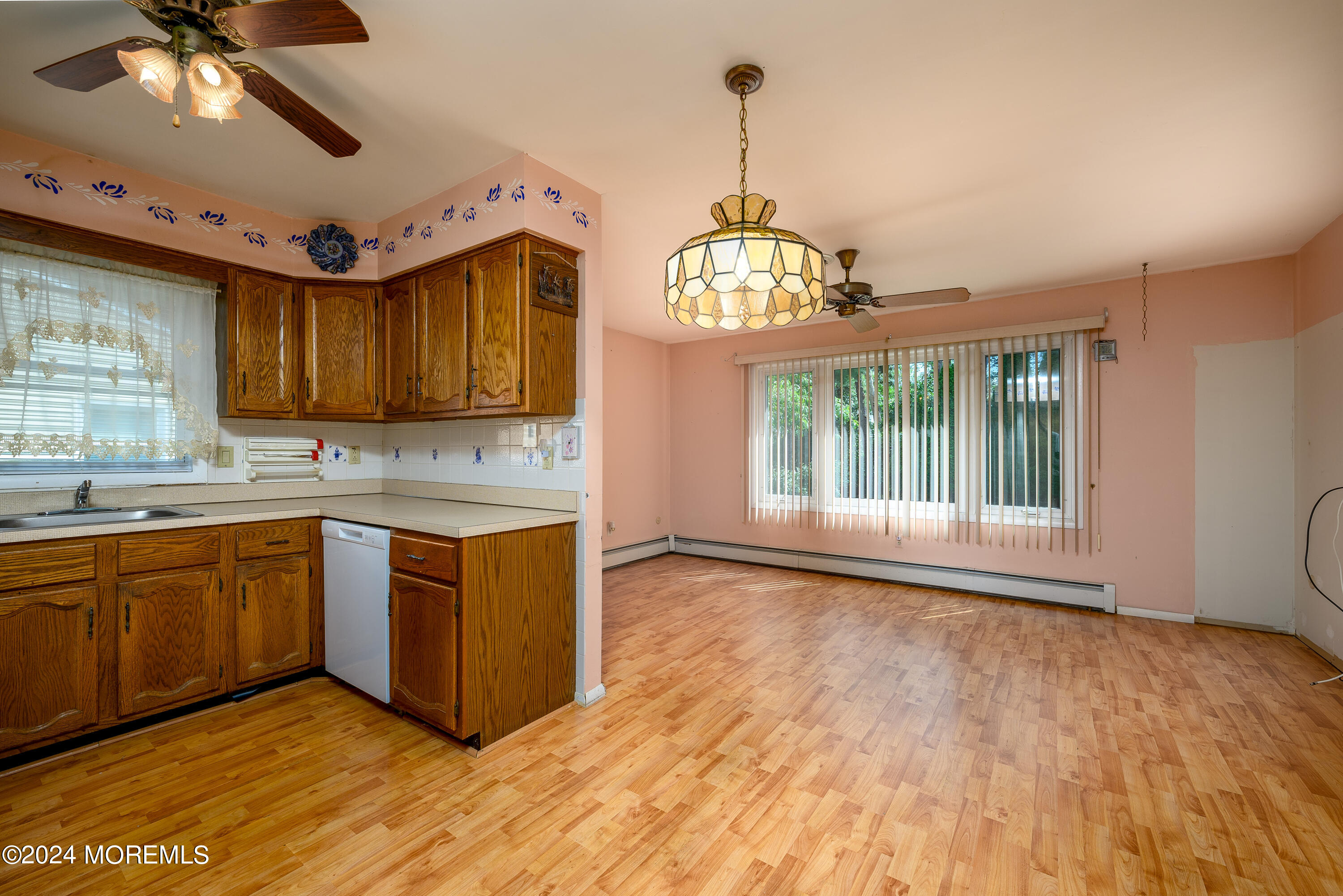 56 Auburn Road Toms River, NJ 08757 - Photo 14 of 28 a kitchen with stainless steel appliances granite countertop a stove and a wooden floors