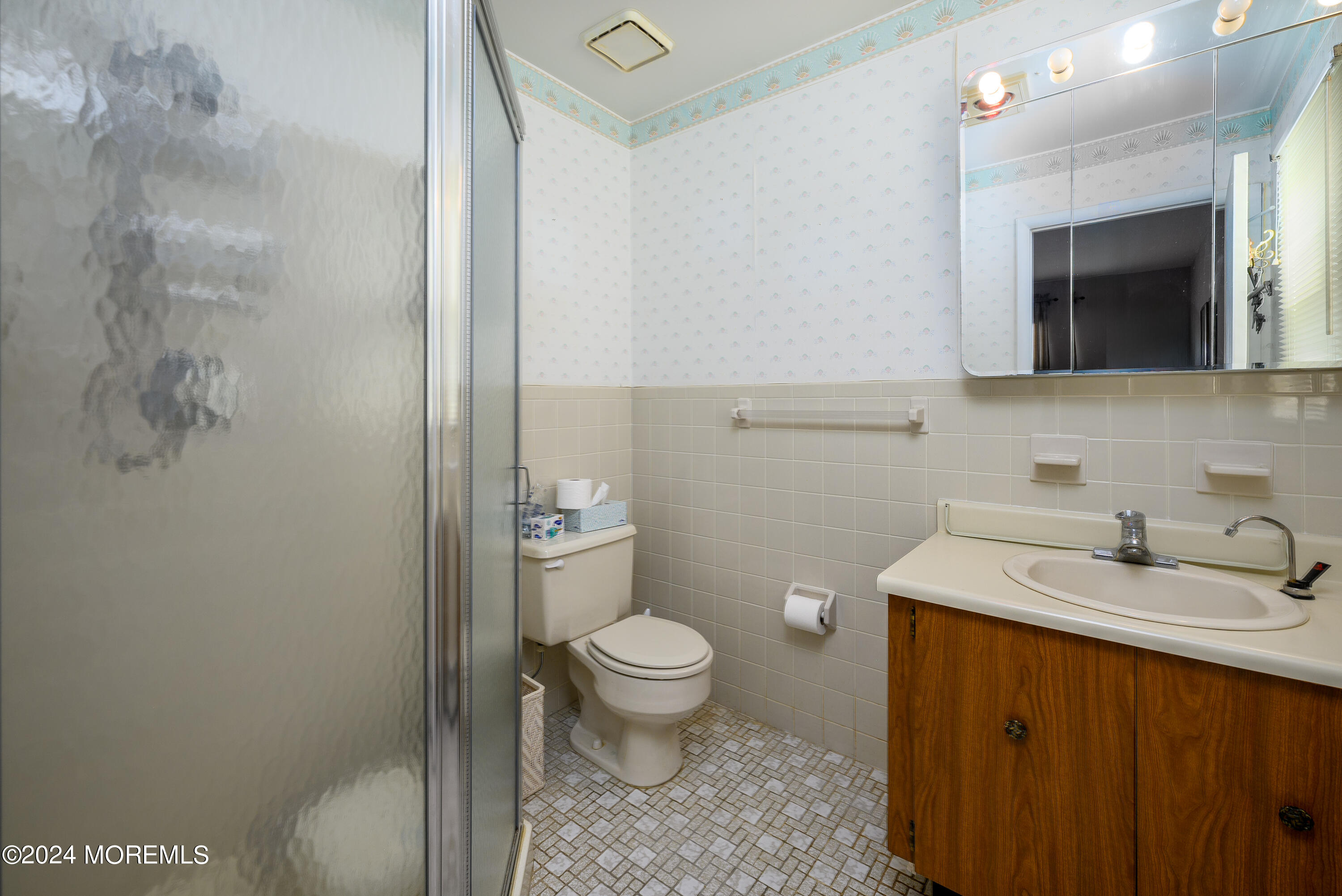 56 Auburn Road Toms River, NJ 08757 - Photo 21 of 28 a bathroom with a granite countertop sink a toilet and a mirror