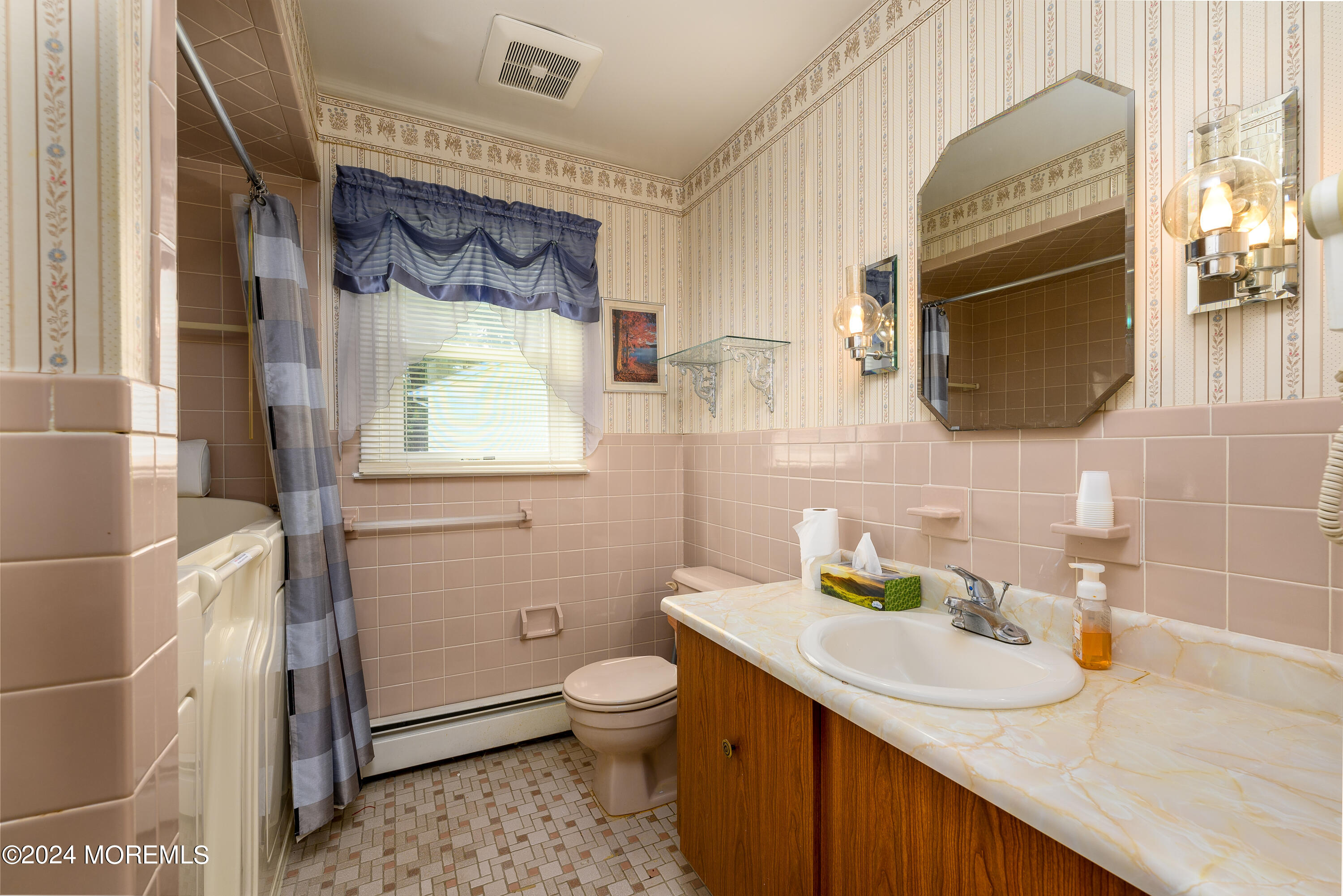 56 Auburn Road Toms River, NJ 08757 - Photo 24 of 28 a bathroom with a sink a toilet and mirror