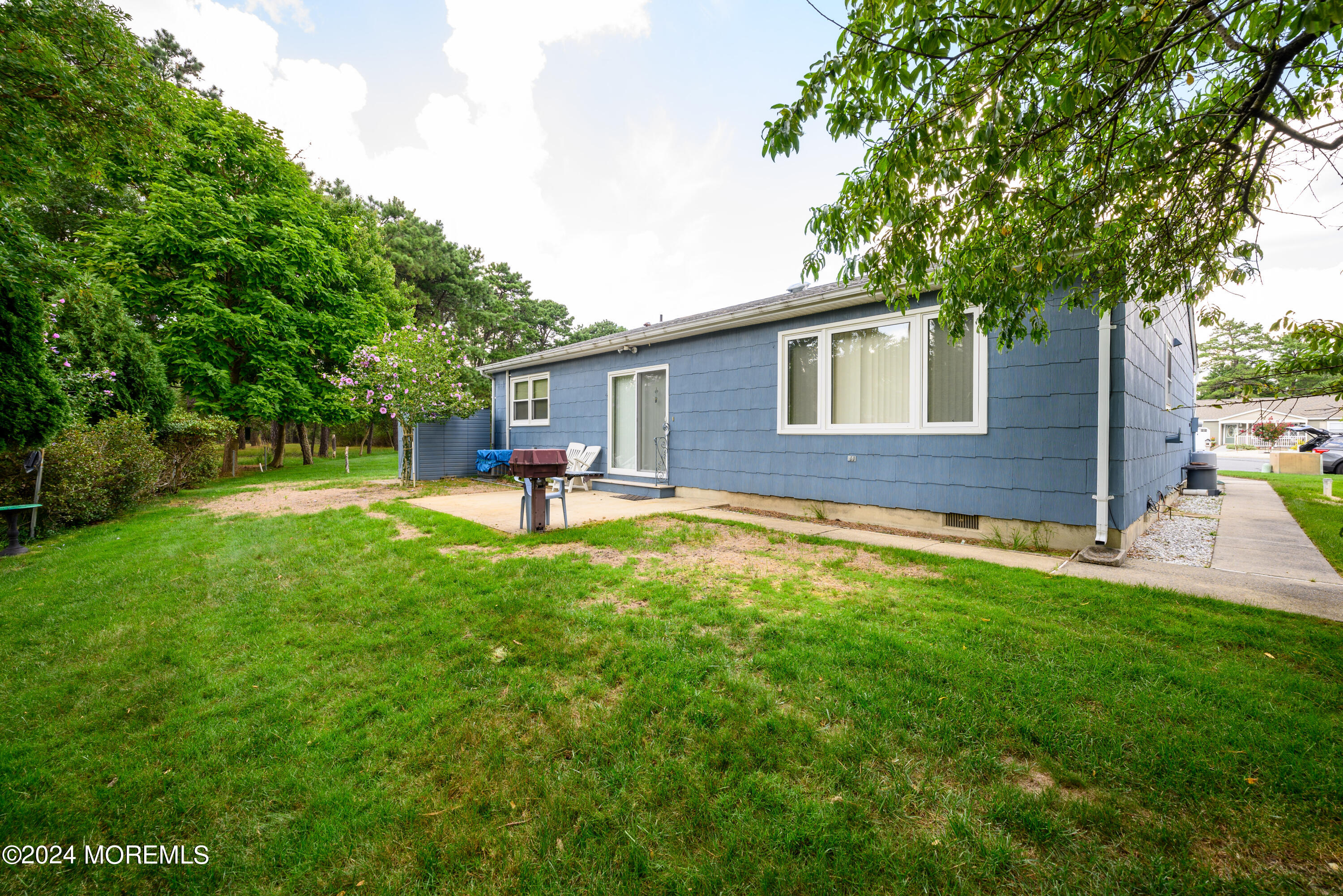 56 Auburn Road Toms River, NJ 08757 - Photo 4 of 28 a view of a house with a yard porch and sitting area