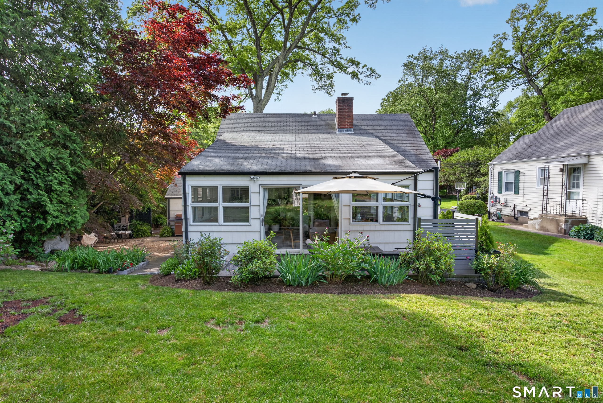 68 Old Elm Road Fairfield, CT 06825 - Photo 38 of 40 a front view of a house with garden